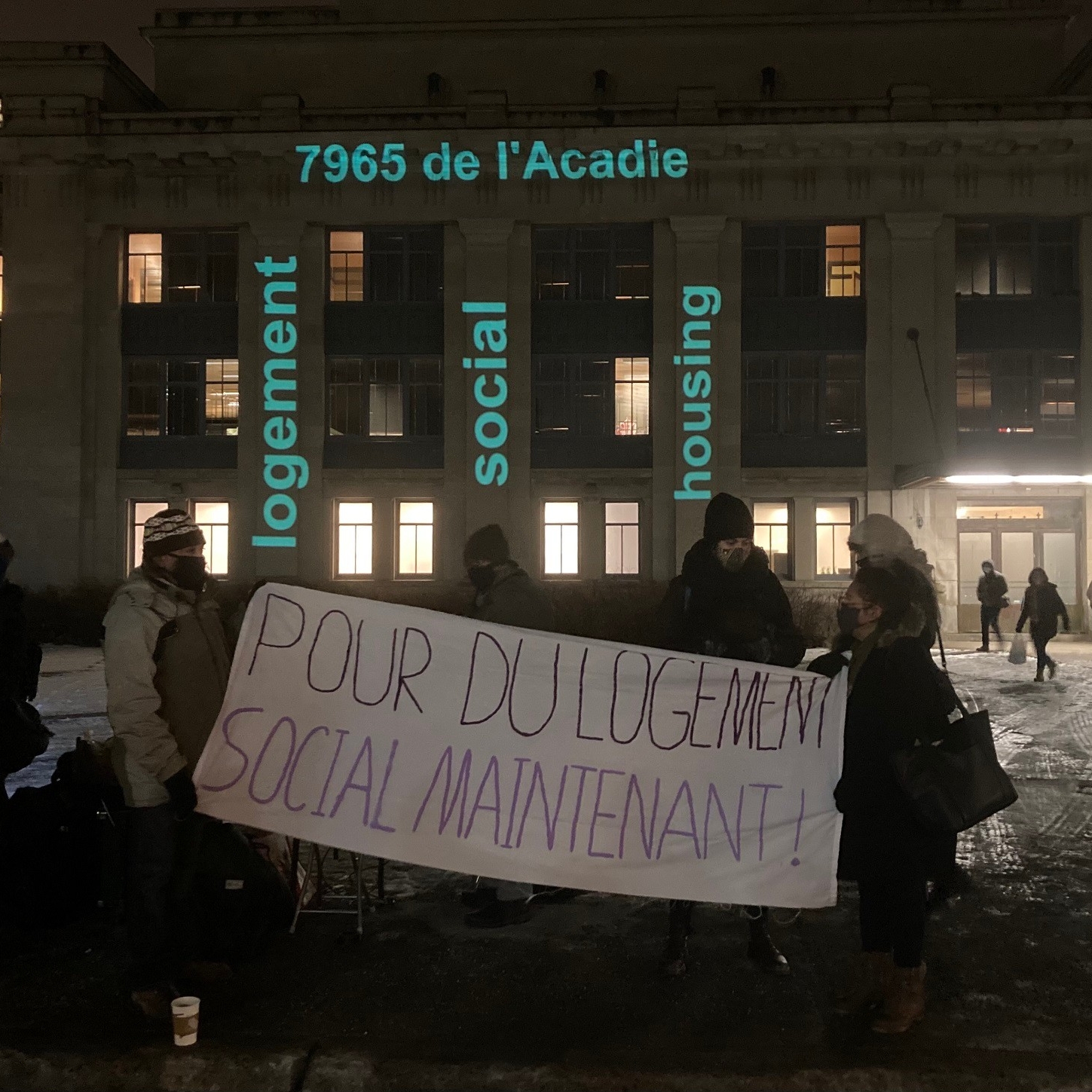 People protesting in front of 7965 de l'Acadie