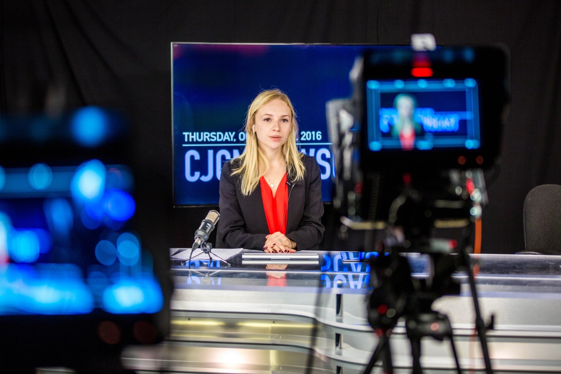 Woman in front of cameras in a studio