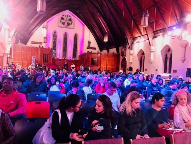 The audience attends the Theology in the City conference in 2019
