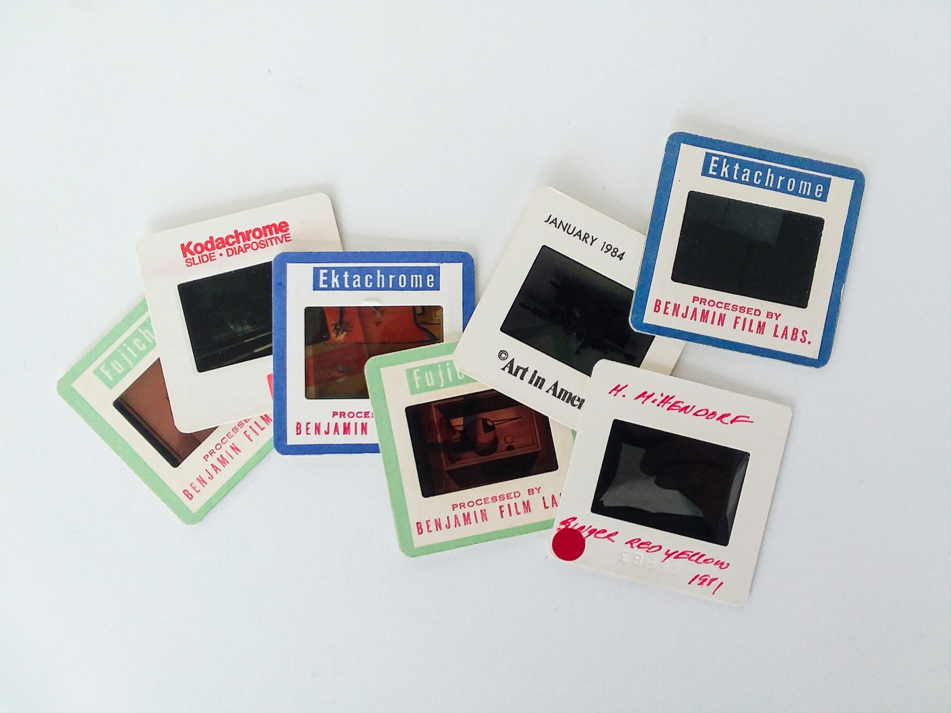 seven 35mm film slides spread across a surface  35 millimeter slides