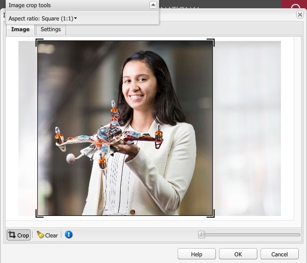 Screenshot of woman holding a drone, cropped to Square