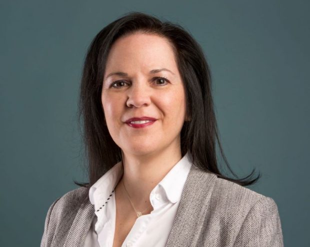 Anna Barrafato Portrait of woman with dark hair and grey suit