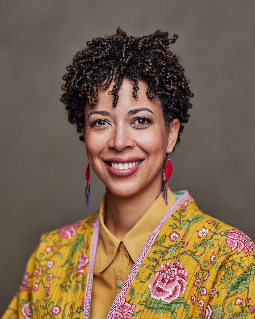 Portrait of a woman wearing a bright floral jacket