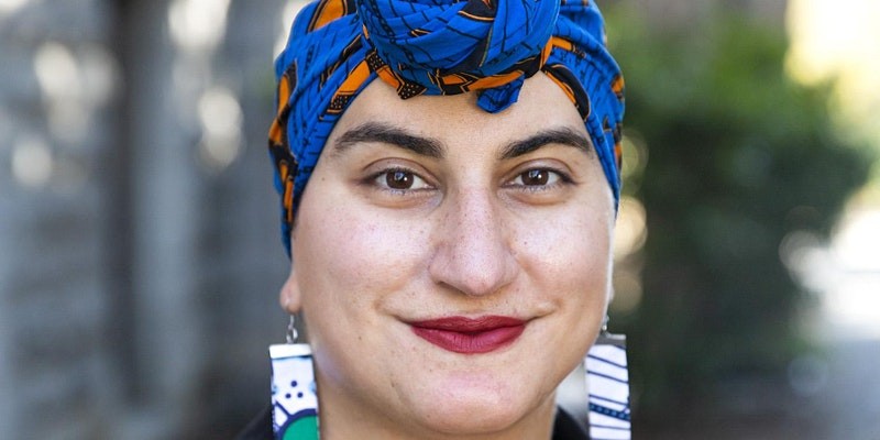 Smiling woman wearing colourful head wrap