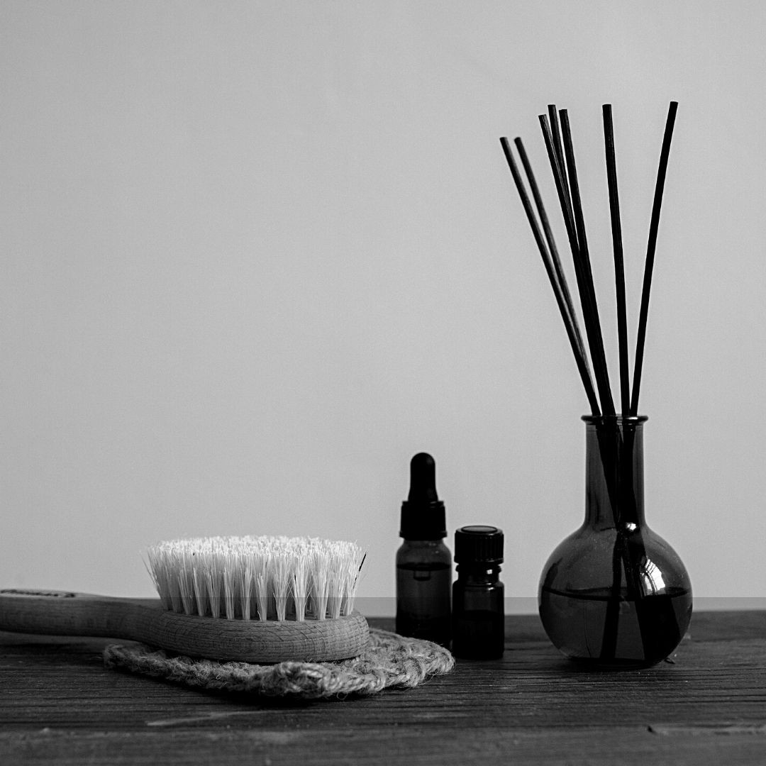 black and white image of dry brush, essential oils and aromatherapy