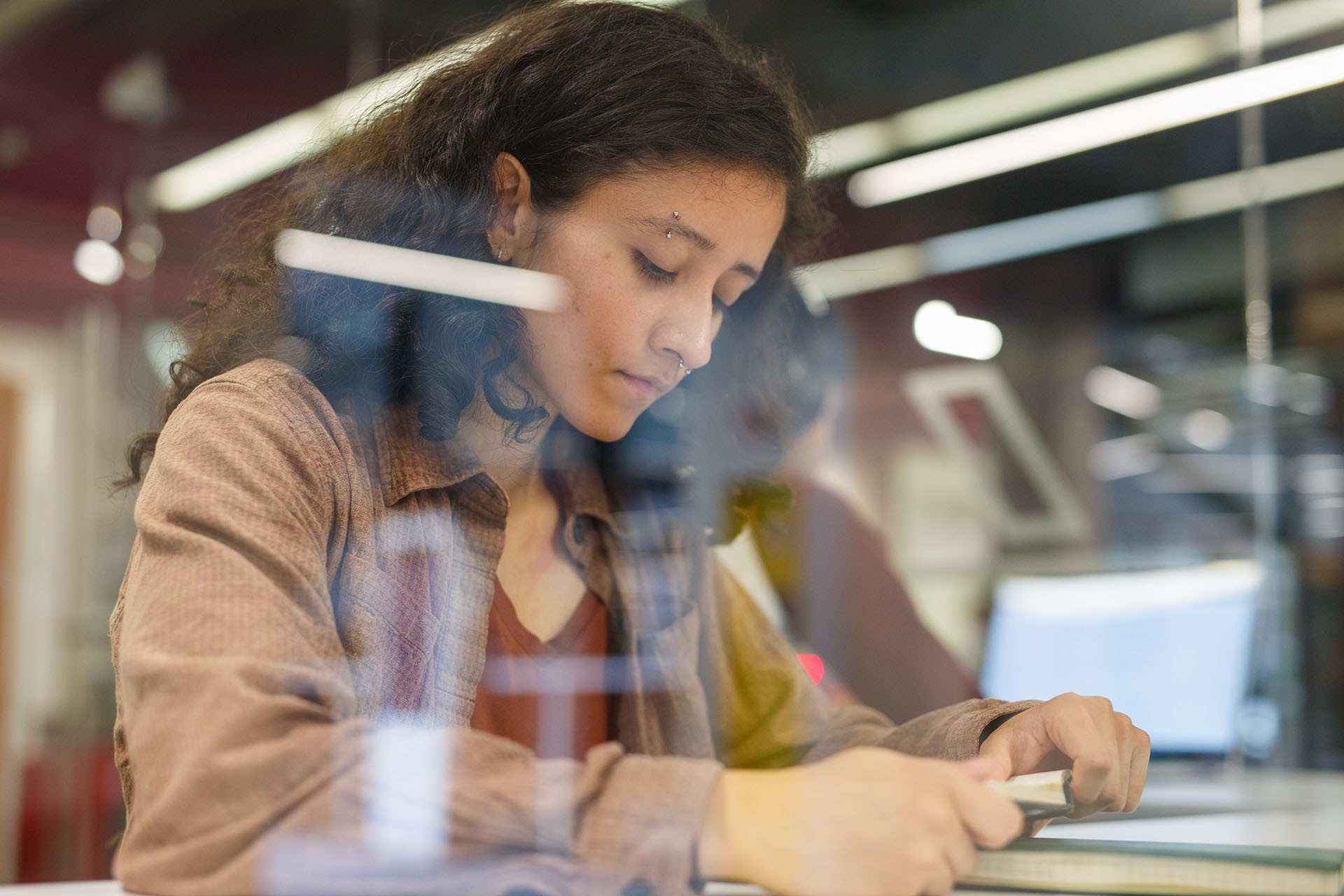 Student reading in the library