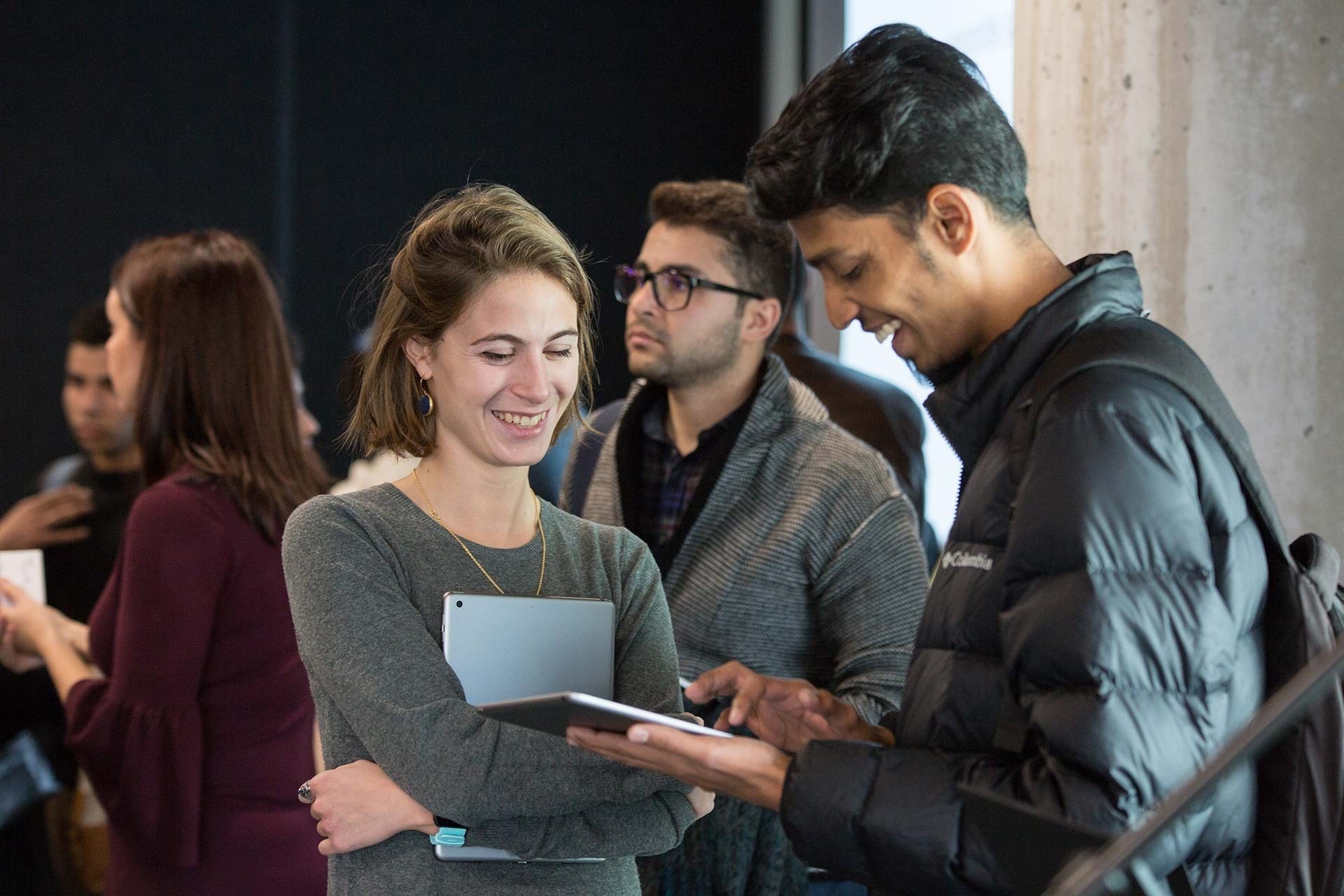 A group of young professionals takes notes