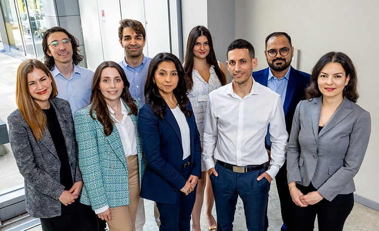 Concordia's ten public scholars standing close and smiling