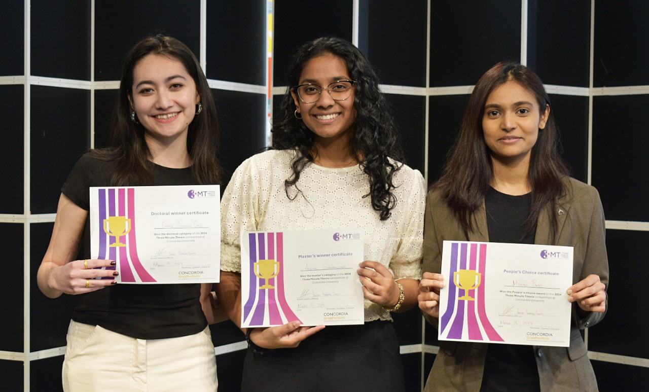 Three winners of the 2024 3MT competition holding their certificates and smiling at the camera