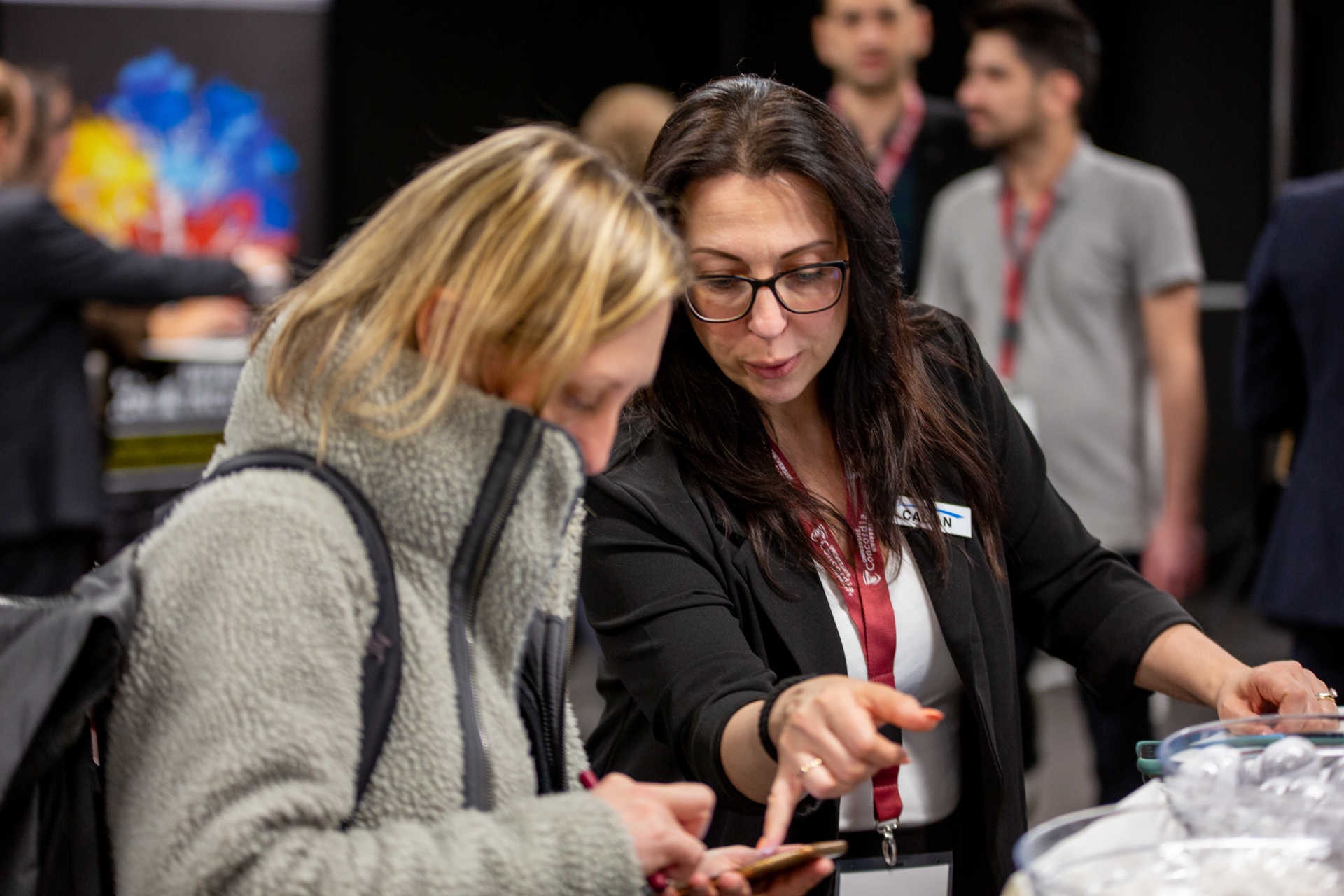 Two people talking to each other in a networking event