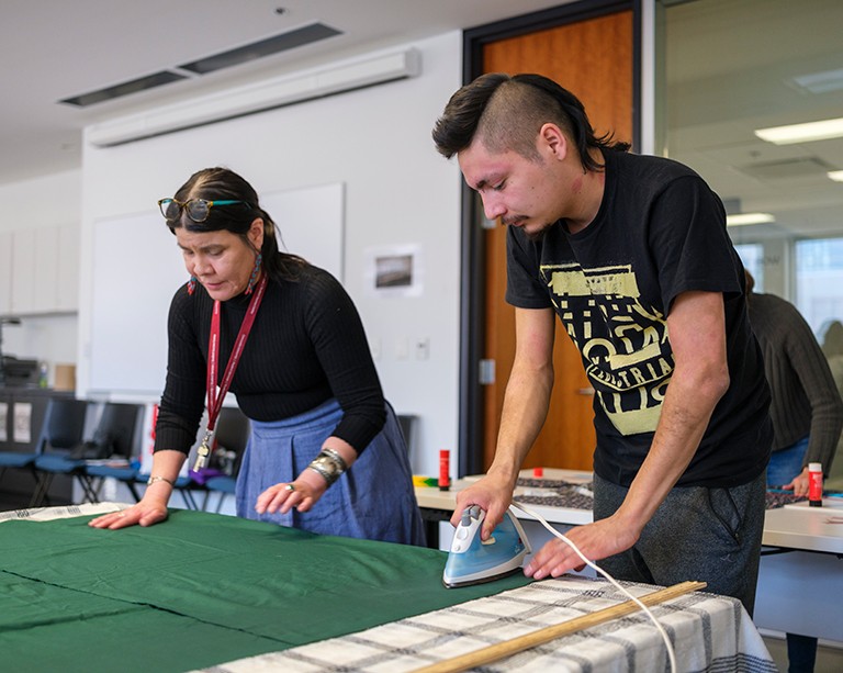 Students in the Kaié:ri Nikawerá:ke Indigenous Bridging Program craft ribbon skirts and shirts in a first-year seminar