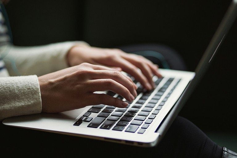 Hands on a laptop