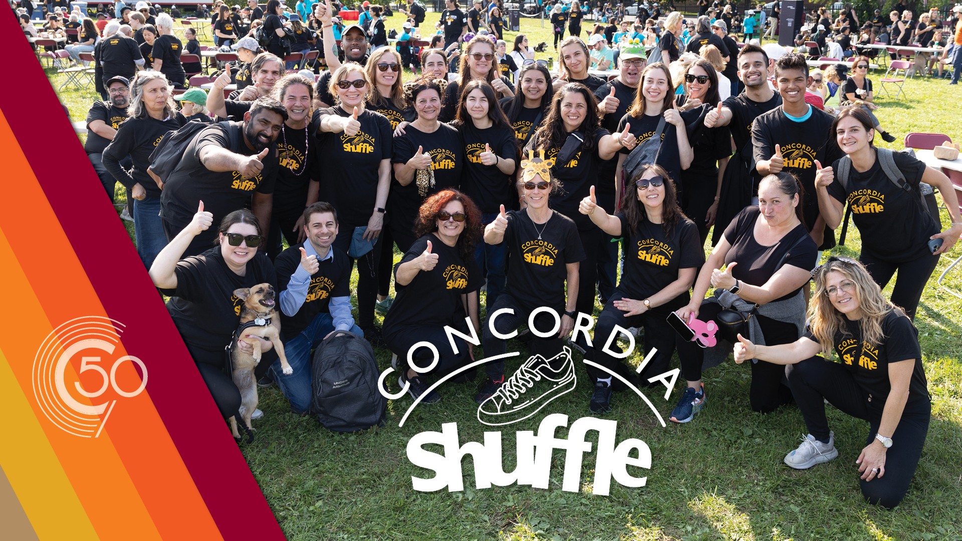 A group of more than 20 Concordia Shufflers wearing their Shuffle T-shirts gather together and give a thumbs up to the camera.