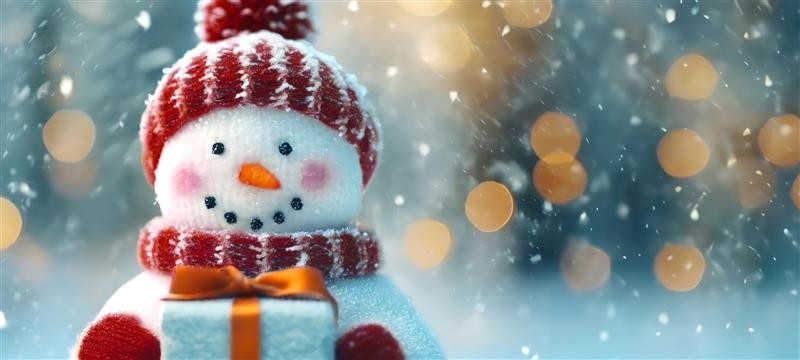 happy snowman wearing a red hat, scarf and mitts holds out a present to the camera, with snow falling in the background