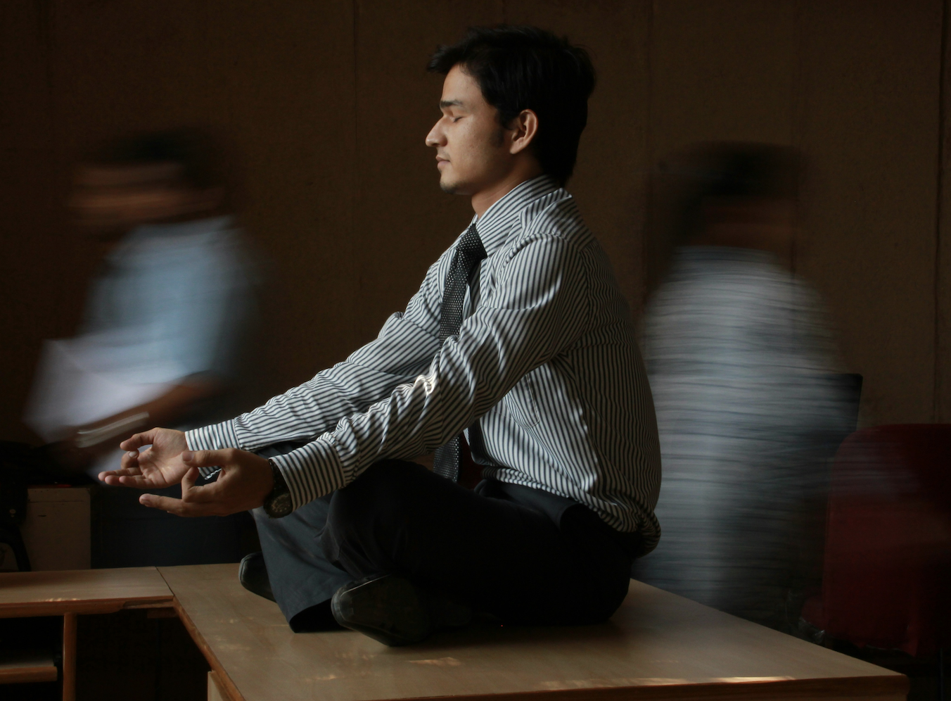 Man meditates at work Man meditates at work