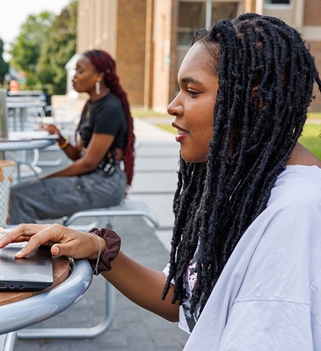 Black Concordia student uses laptop