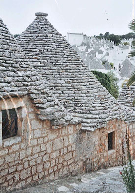 Alberobello's trulli, conical-roofed, limestone houses