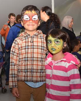 Darian, 5, and his sister Donya, 4, show their painted faces