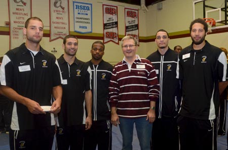 Concordia President Alan Shepard with members of the basketball team